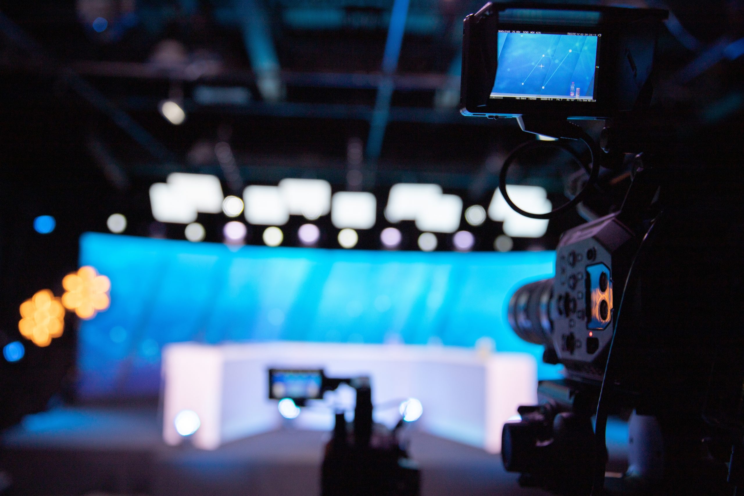A camera pointing at an empty newsroom